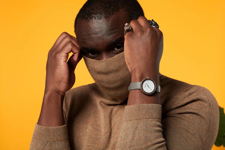 A man wearing pebble color hemp watch