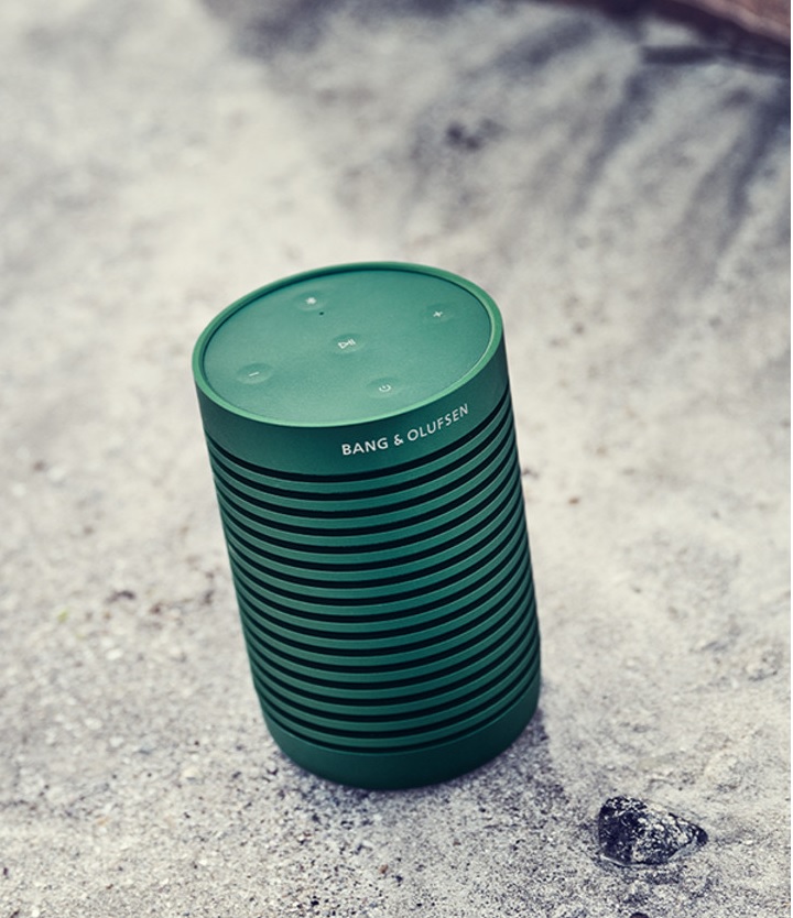 Beosound Explore Speaker placed on a sandy surface