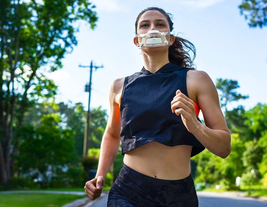 A girl wearing Calibre fitness tracker