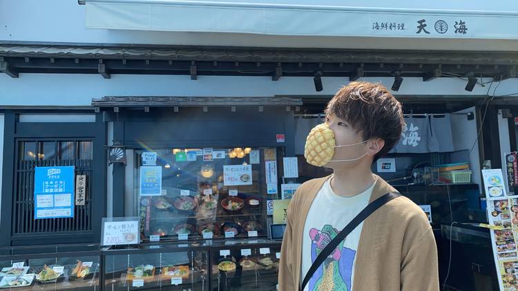 Japanese boy wearing Melonpan bread edible facemask