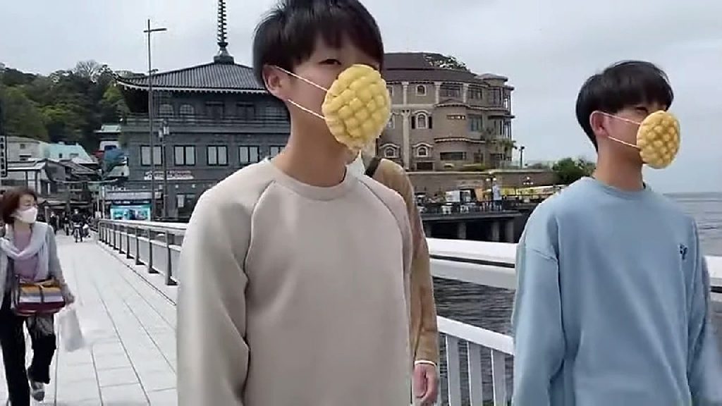 Japanese boys wearing Melonpan bread edible facemask