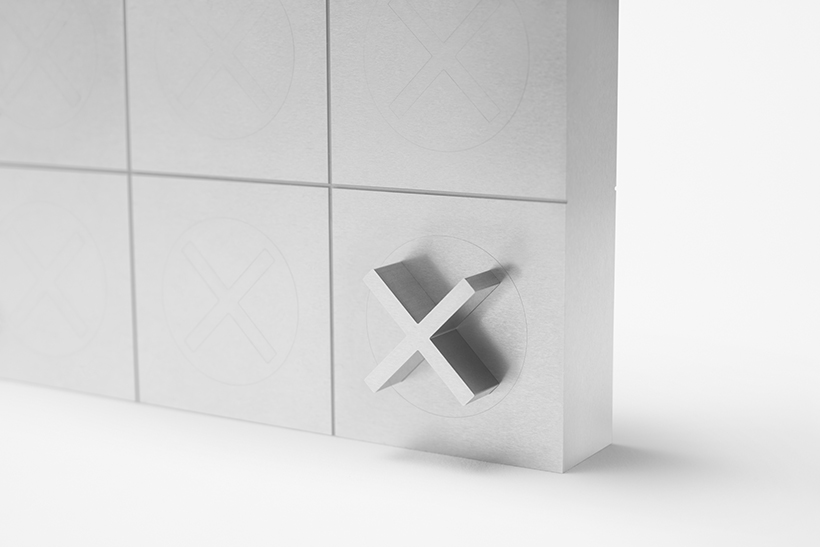 Cross on Nendo Tic-Tac-Toe board