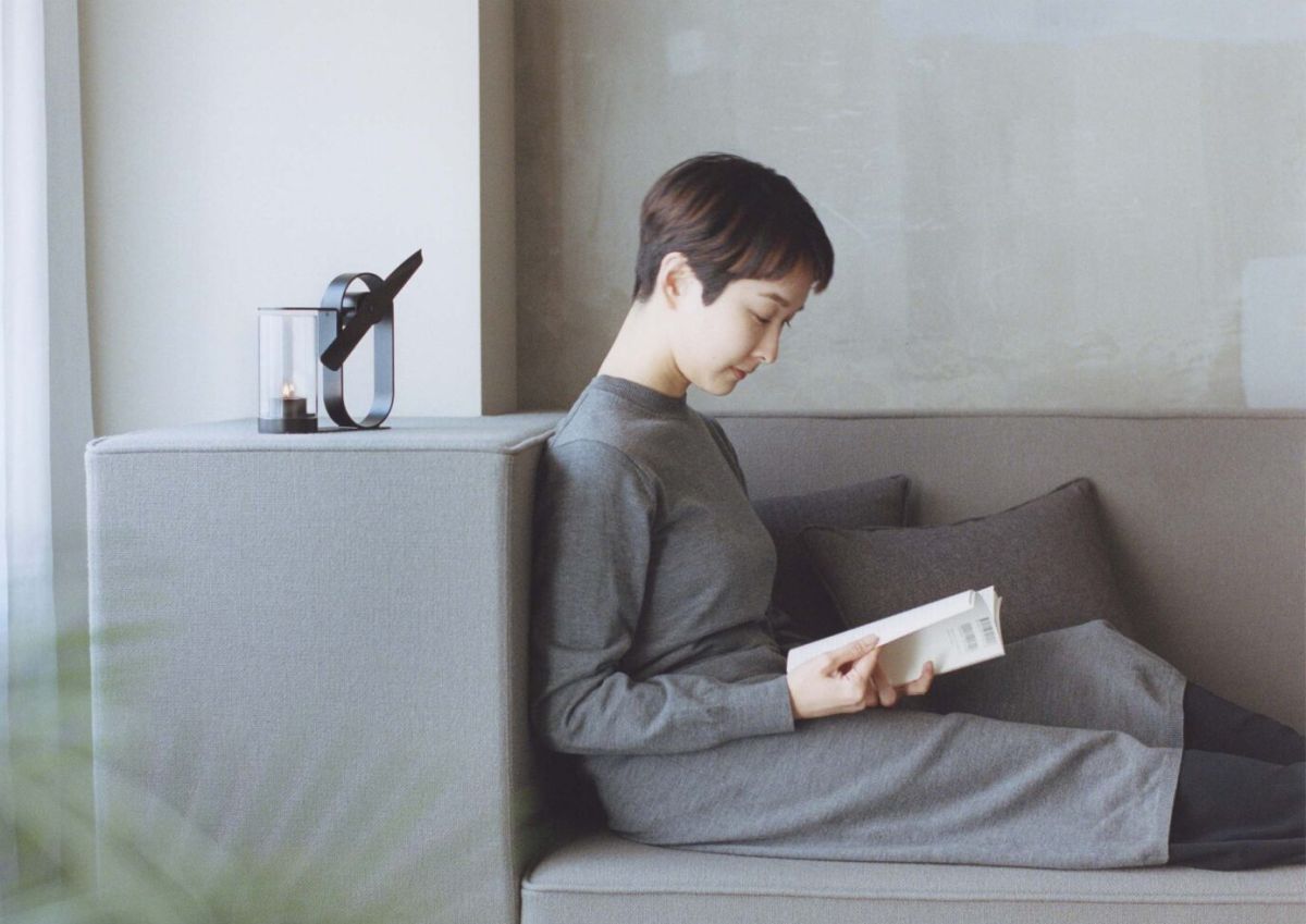 Girl reading book in a room scented by Lei aroma diffuser