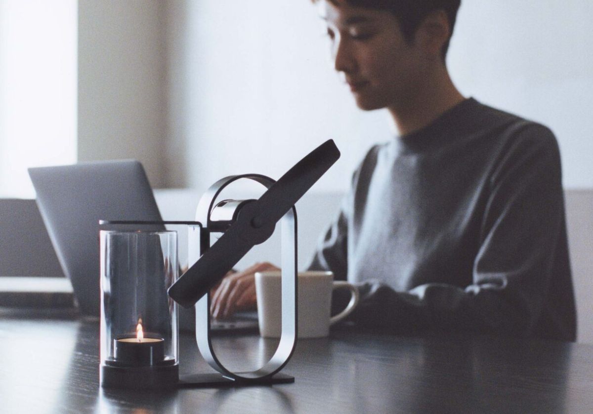 Lighted candle inside Lei aroma diffuser glass cover