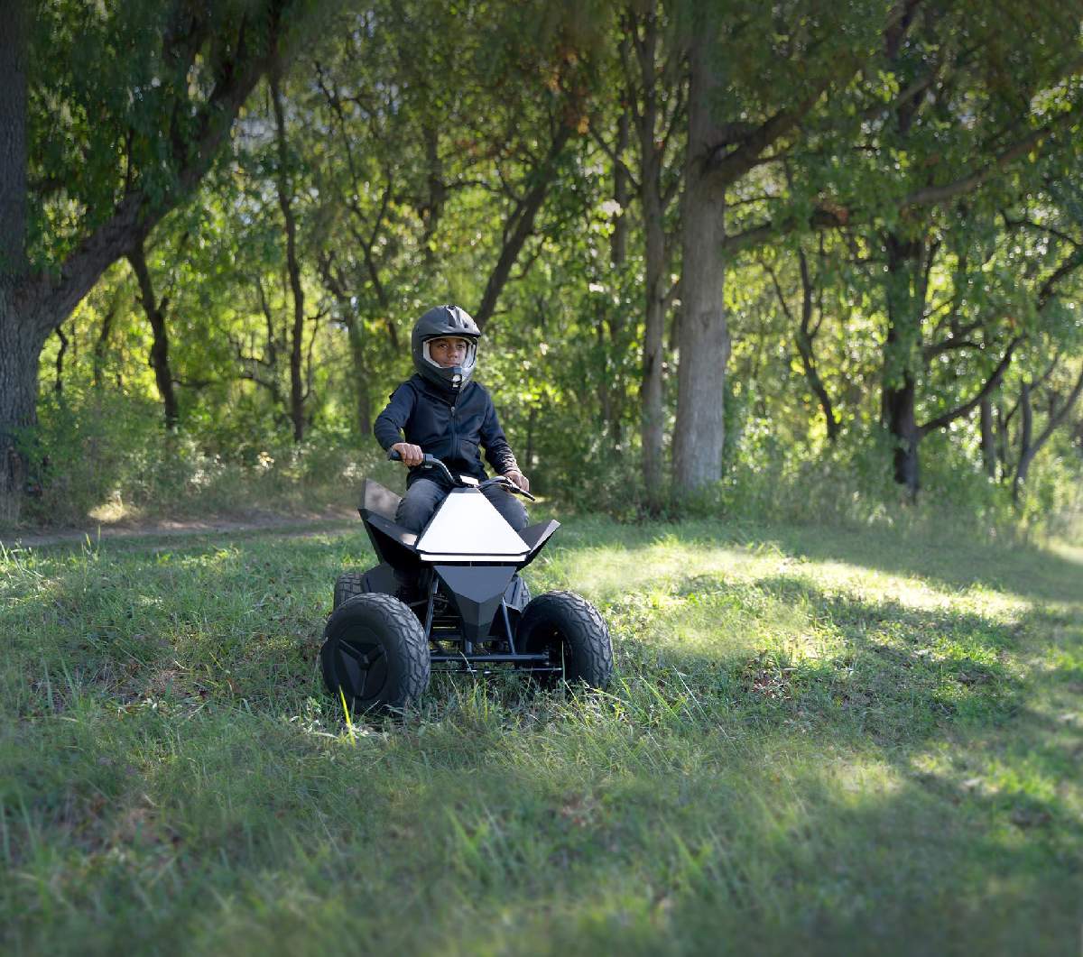 A kid driving Tesla Cyberquad