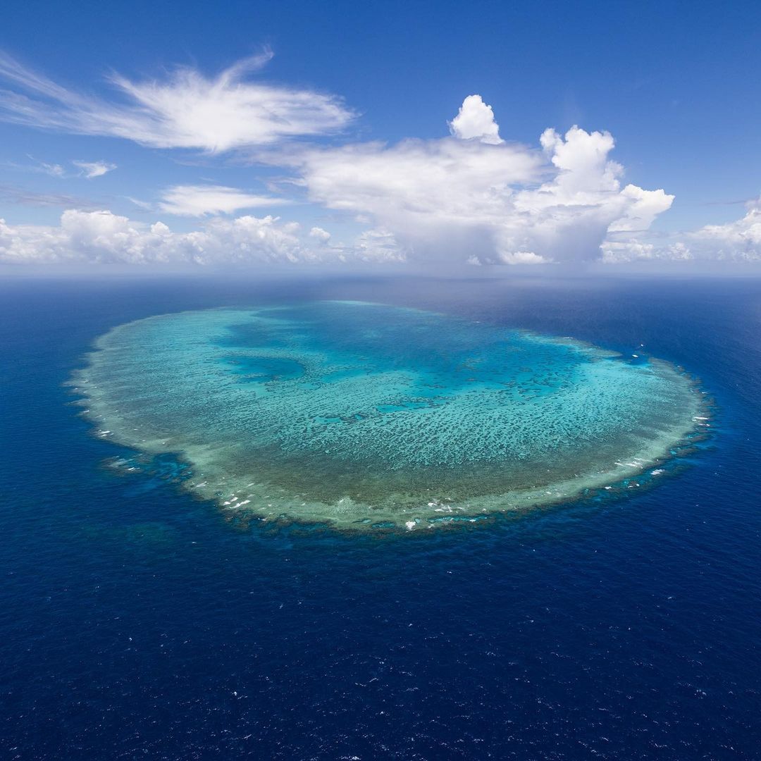 A Coral-reef lagoon overshadowed by clouds