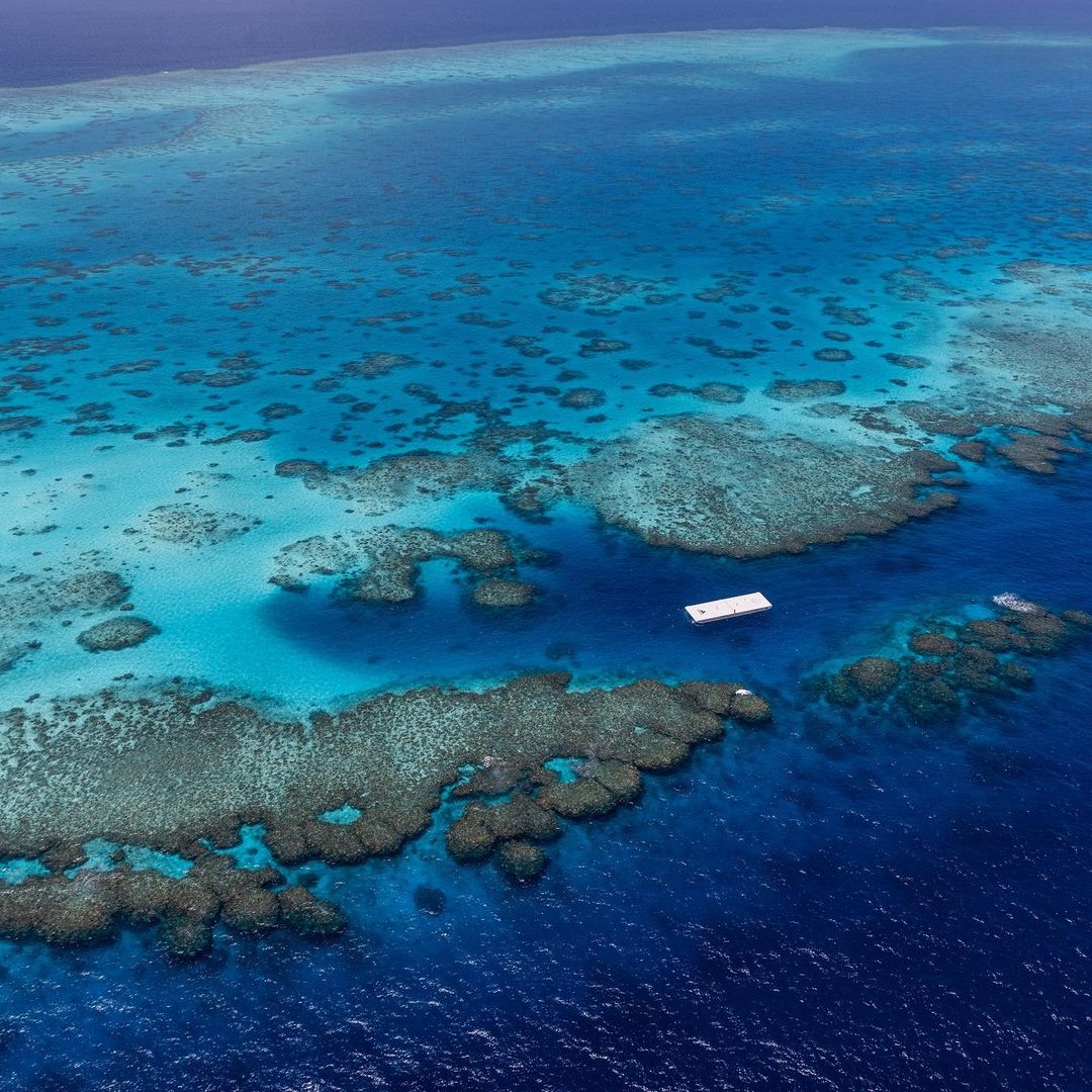 Distant view of great barrier reef and floating tennis court