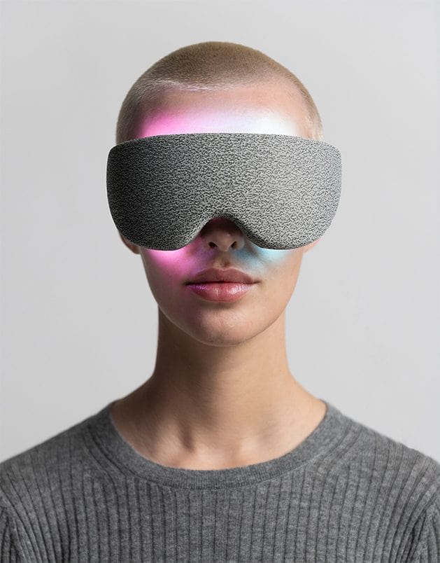 A girld wearing Resonate LightVision meditation headset