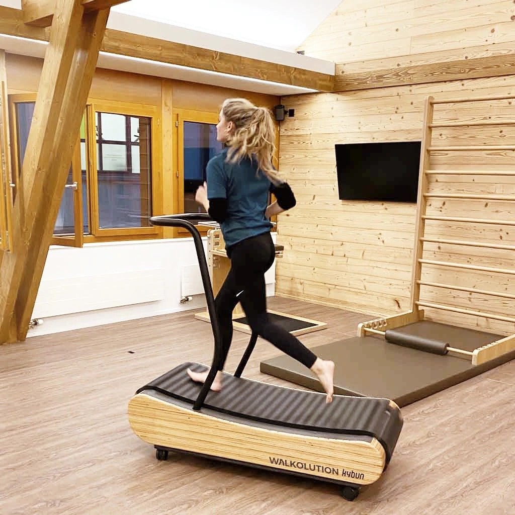 A girl running on Walkolution treadmill desk