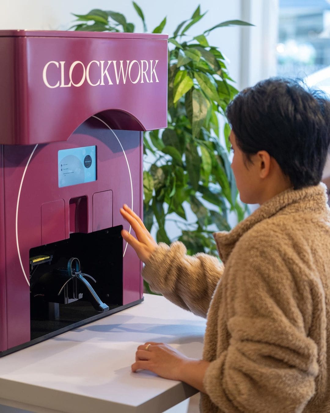 A girl using Clockwork manicure machine screen