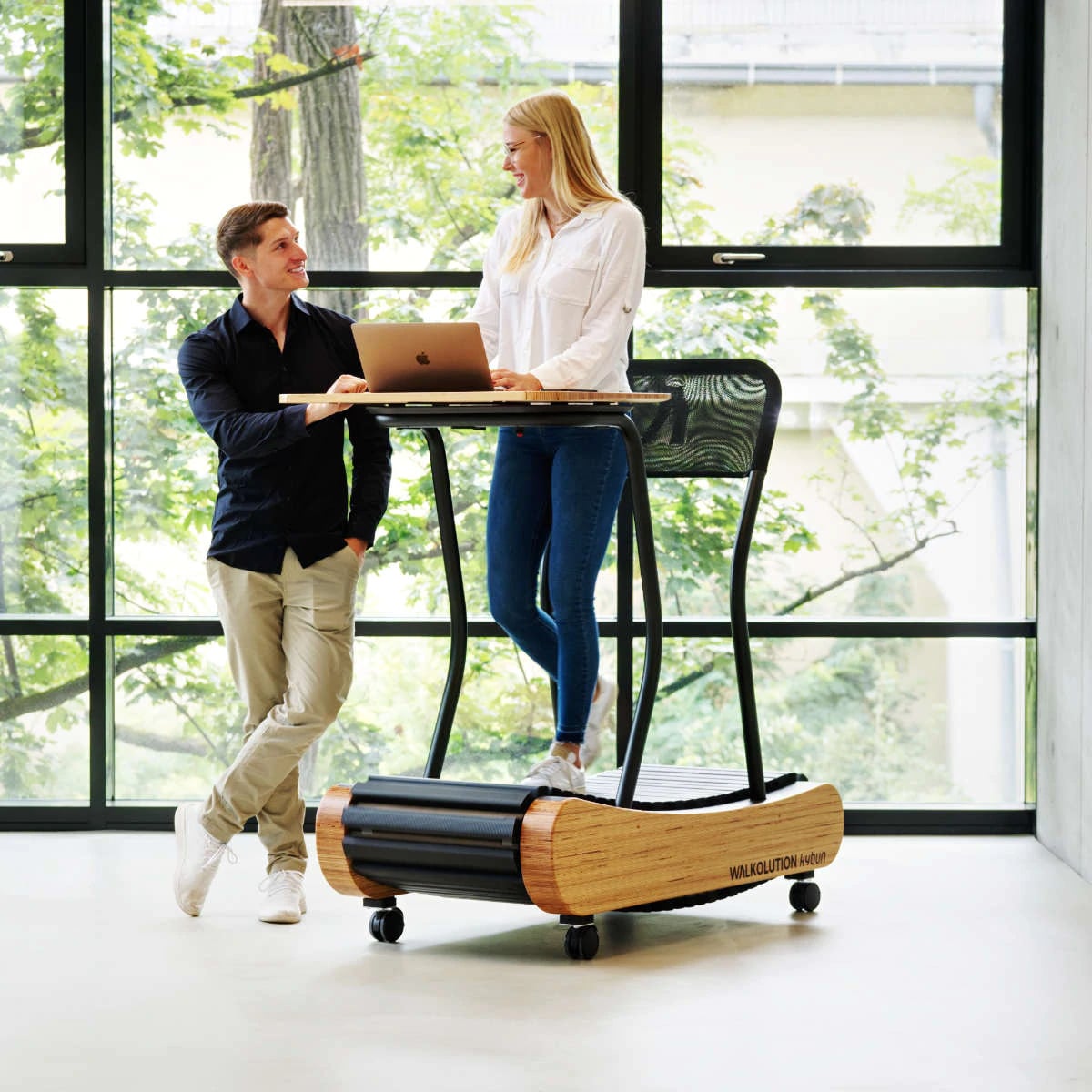 A girl working on Walkolution treadmill desk