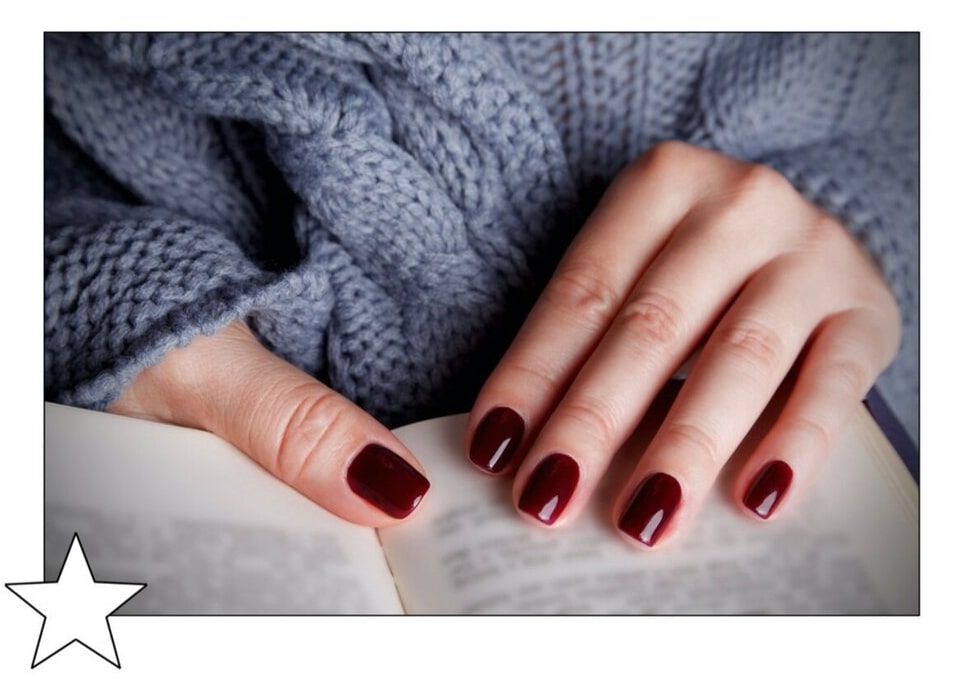 Lady showing her nails manicured by Clockwork robot