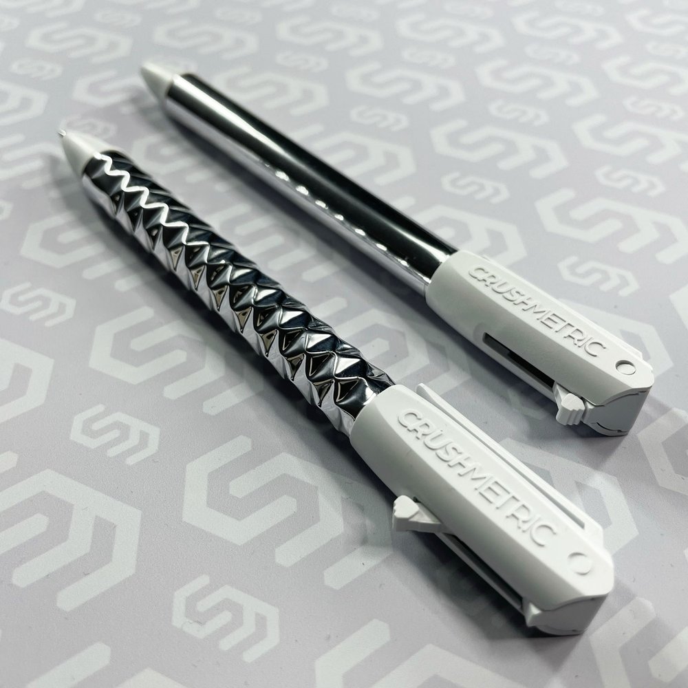 A pair of CRUSHMETRIC SwitchPen clicker pens